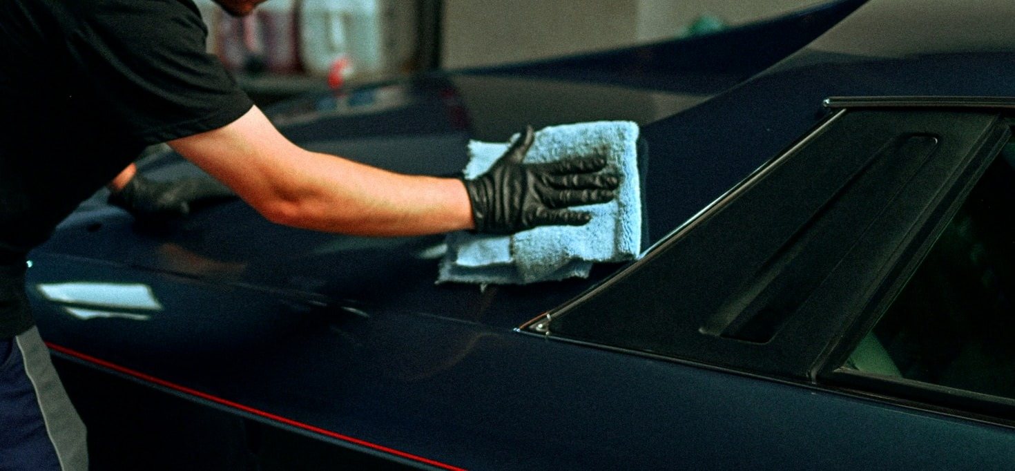 Microfiber towel cleaning a daily-driver door pocket
